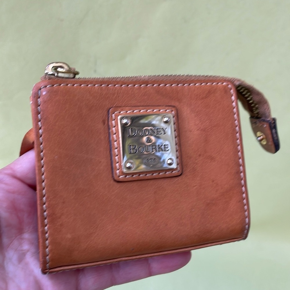 Vintage and unique orange Dooney & Bourke leather mini wallet